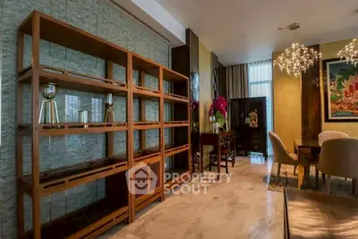 Luxurious living room with elegant decor and modern lighting fixtures.