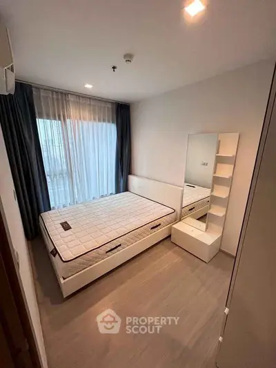 Modern bedroom with minimalist design and ample natural light