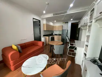 Modern living room with stylish furniture and open kitchen layout