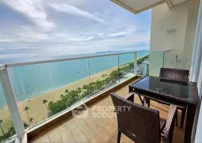 Stunning beachfront balcony with panoramic ocean views and elegant outdoor seating.