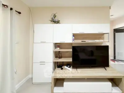 Modern living room with sleek TV unit and stylish storage cabinets