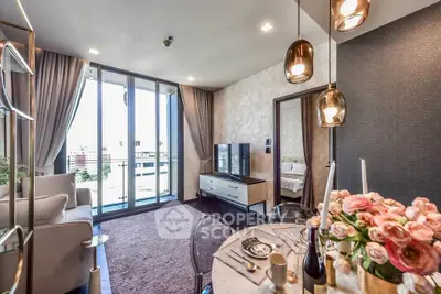 Luxurious modern living room with elegant decor and city view balcony.