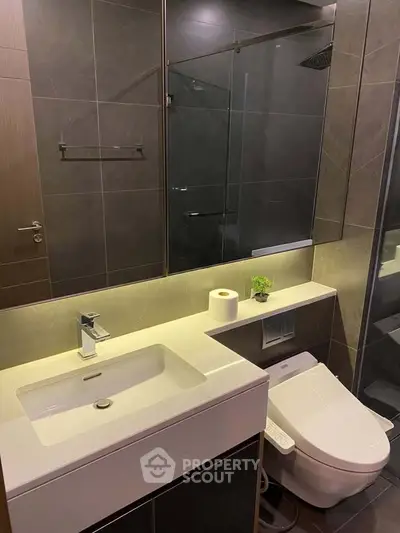 Modern bathroom with sleek fixtures and ambient lighting