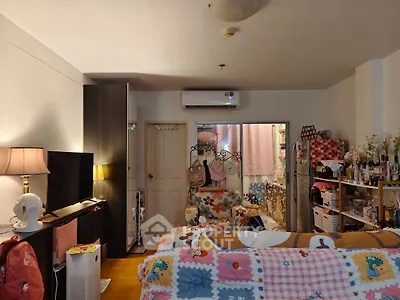 Cozy living room with colorful decor and air conditioning