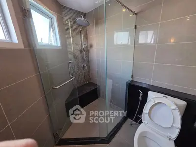 Modern bathroom with glass shower and sleek tile design