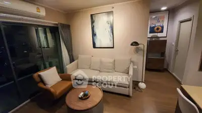Modern living room with cozy sofa, stylish decor, and balcony view in a chic apartment.