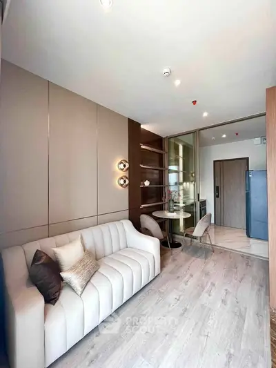 Modern living room with elegant sofa and dining area in a stylish apartment