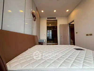 Spacious modern bedroom with sleek design and ample natural light