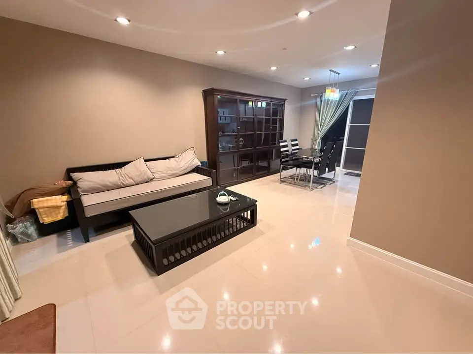 Spacious living room with modern furniture and elegant dining area