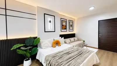 Modern bedroom with stylish decor and cozy seating area