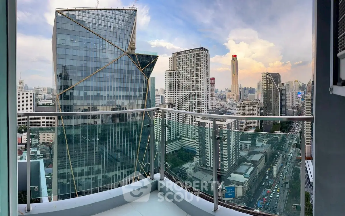 Stunning cityscape view from a high-rise balcony with modern architecture.