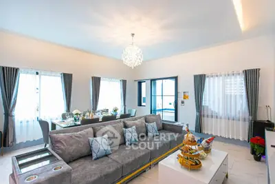 Luxurious living room with elegant decor and spacious seating area, perfect for entertaining guests.