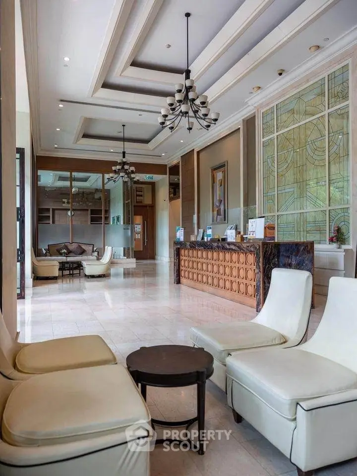 Luxurious hotel lobby with elegant seating and chandelier lighting