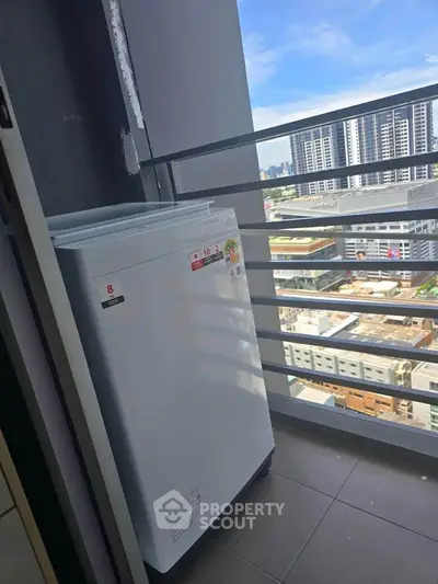 High-rise balcony with city view and washing machine, perfect for urban living.