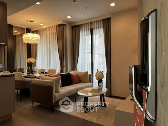 Luxurious living room with elegant decor and large windows in modern apartment