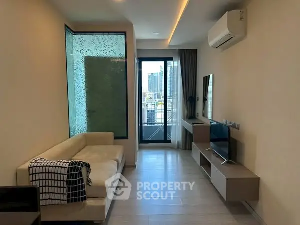 Modern living room with balcony view in high-rise apartment