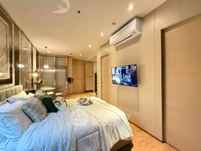 Luxurious modern bedroom with stylish decor and ambient lighting