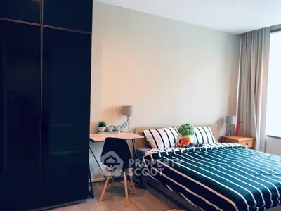 Modern bedroom with stylish decor and ample natural light