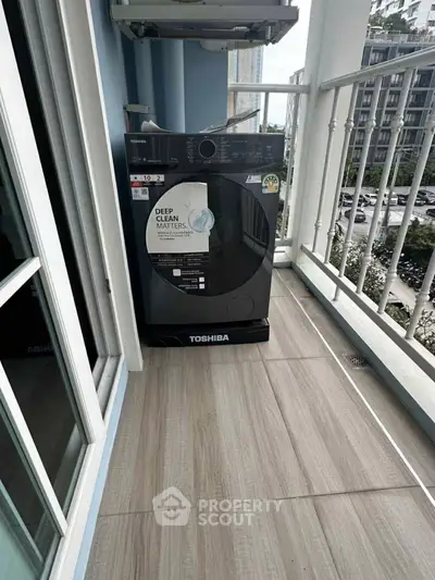 Modern balcony with Toshiba washing machine and city view