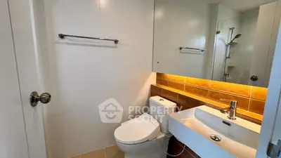 Modern bathroom with sleek fixtures and ambient lighting