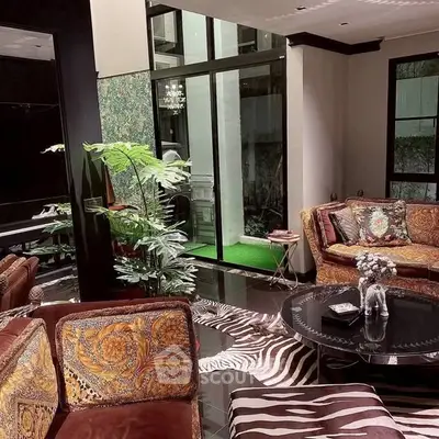 Luxurious living room with elegant decor and large windows