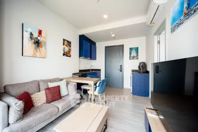 Modern living room with stylish decor and open kitchen layout