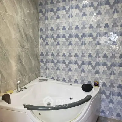 Luxurious bathroom with modern jacuzzi and stylish tile design