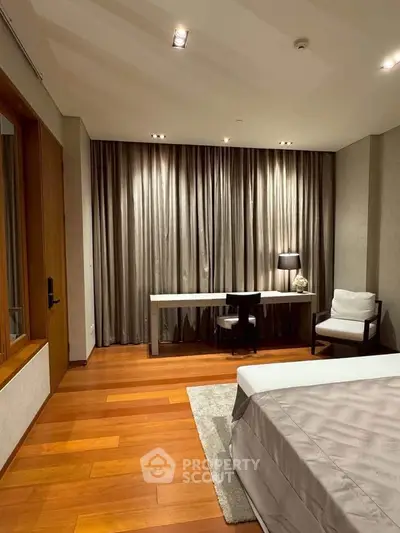 Luxurious bedroom with elegant wooden flooring and stylish decor