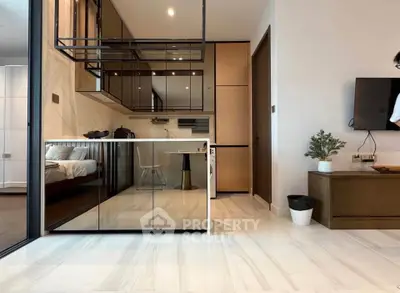 Modern open-plan living room with sleek kitchen and stylish decor