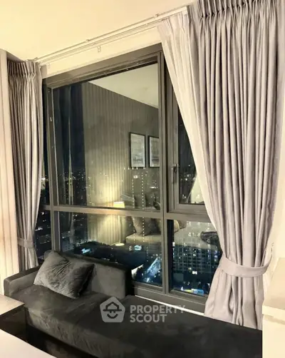 Luxurious high-rise apartment with stunning city view at night