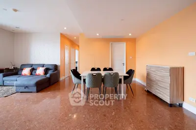 Spacious modern living room with stylish dining area and sleek furniture