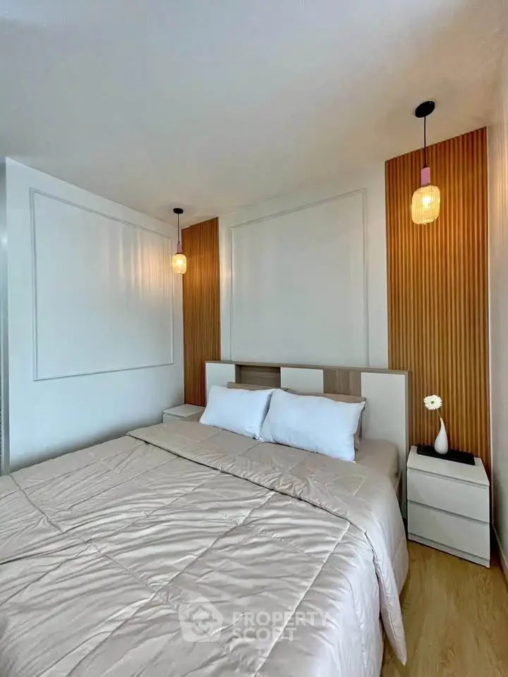 Modern bedroom with stylish lighting and wooden accents, featuring a cozy bed and elegant decor.