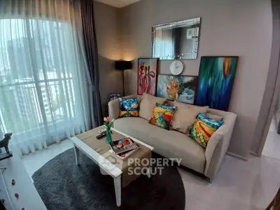 Stylish living room with vibrant decor and city view, perfect for modern urban living.