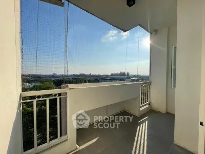 Spacious balcony with panoramic view and safety netting, perfect for relaxation and enjoying the outdoors.