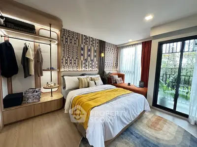 Stylish bedroom with modern decor and balcony view