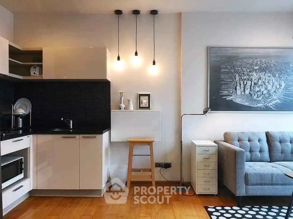 Modern living room with stylish kitchen and cozy seating area