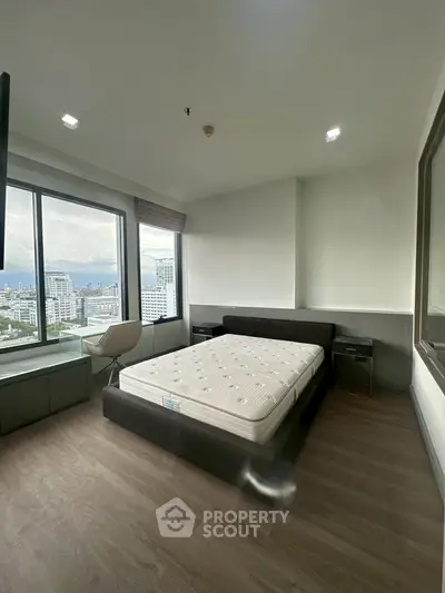 Spacious bedroom with stunning city view and modern furnishings
