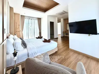 Spacious modern bedroom with elegant decor and natural light