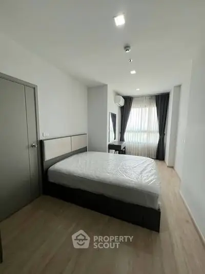 Spacious modern bedroom with natural light and minimalist design
