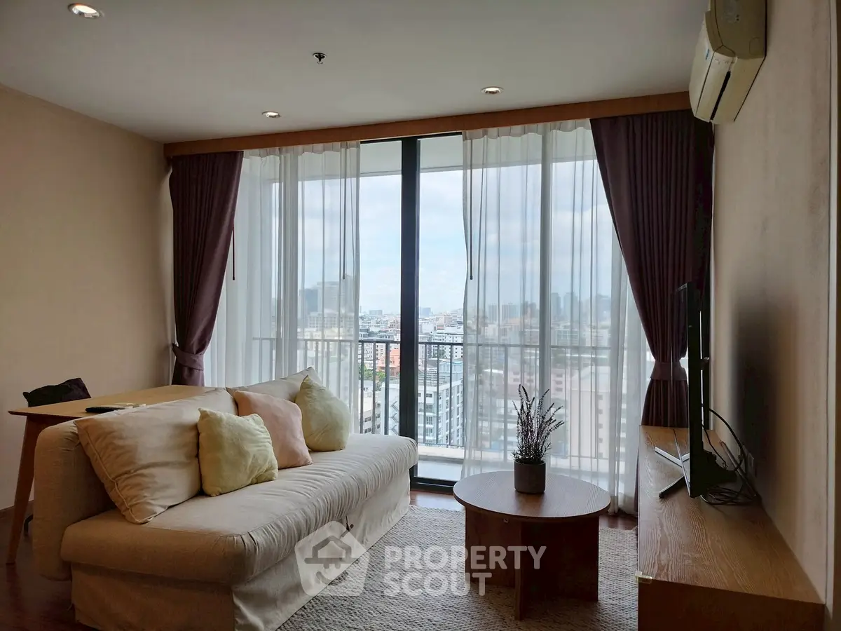 Spacious living room with city view and modern decor