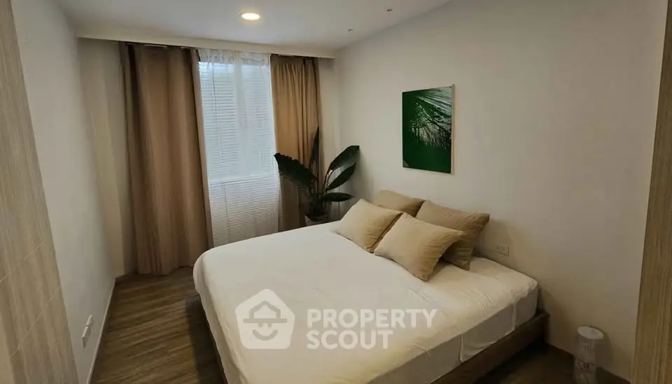 Cozy bedroom with modern decor and natural light