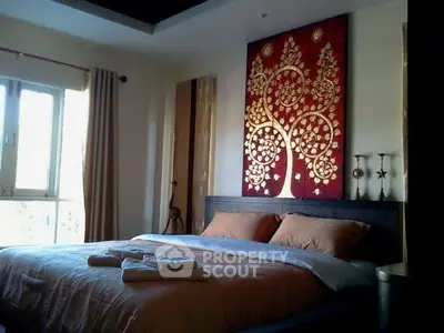 Elegant bedroom with artistic wall decor and natural light