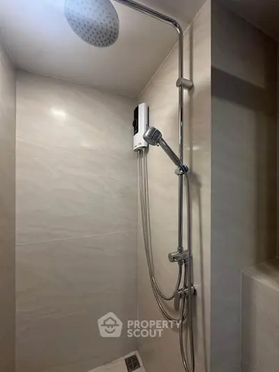 Modern bathroom shower with sleek fixtures and elegant tile design