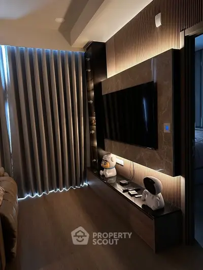 Modern living room with sleek TV setup and ambient lighting