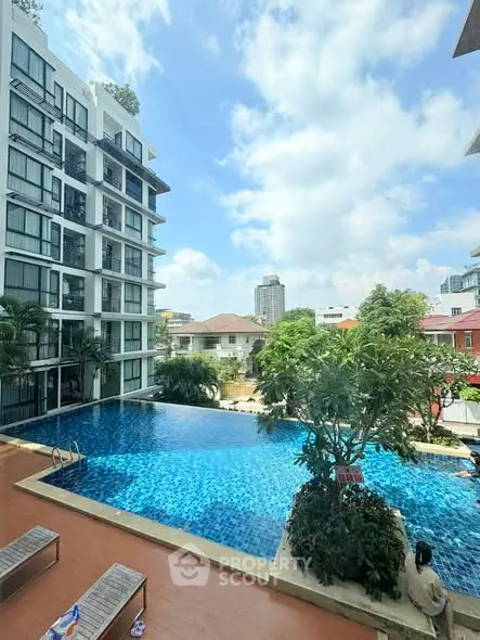 Luxurious apartment building with stunning pool and city view