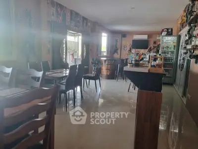 Charming dining area with stylish decor and ample natural light, perfect for gatherings.