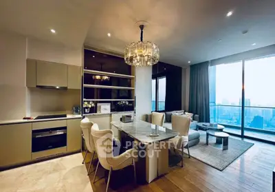 Luxurious open-plan living room with modern kitchen and stunning city view.