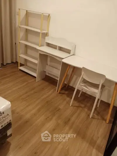 Modern study room with wooden flooring and minimalist furniture