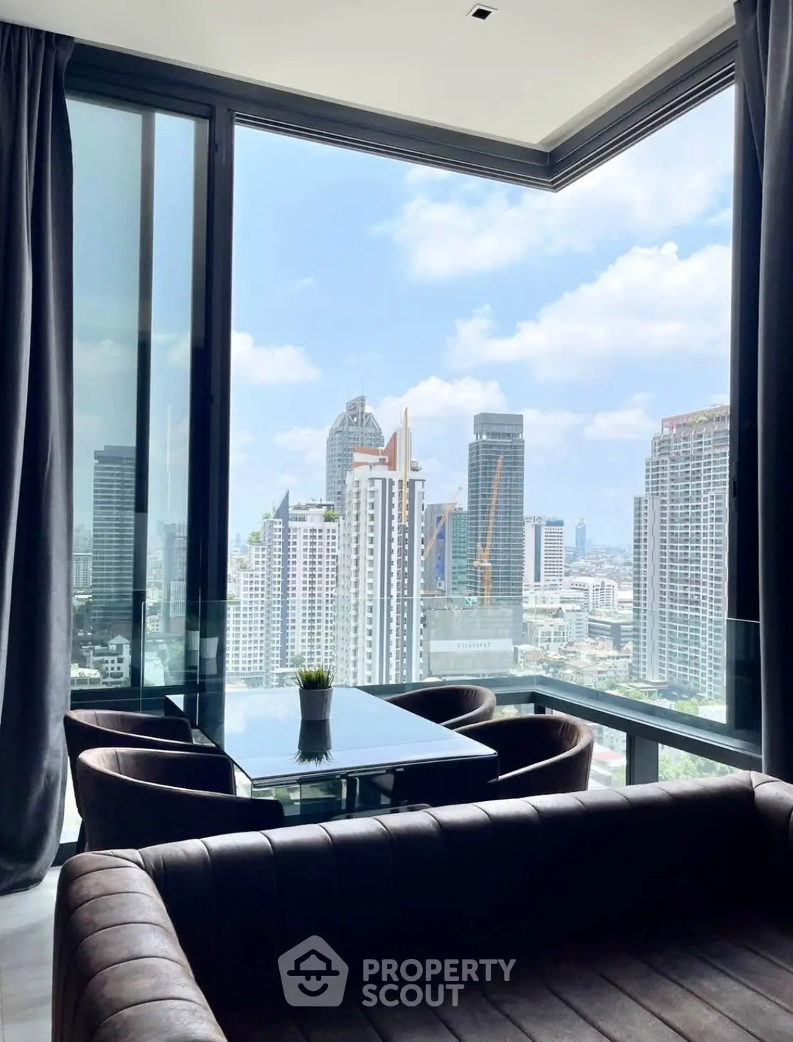 Luxurious corner unit with stunning city view from modern living room.