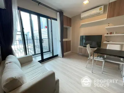 Modern living room with balcony view in high-rise apartment